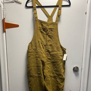 Olive coloured overalls. With tags
